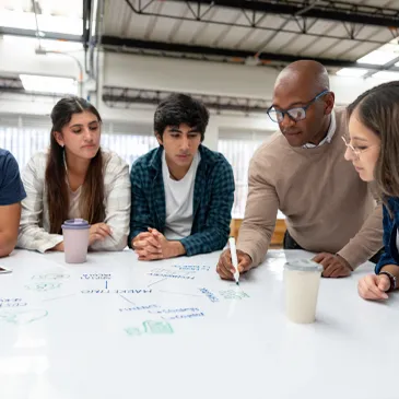 Group brainstorming session with diverse team members.